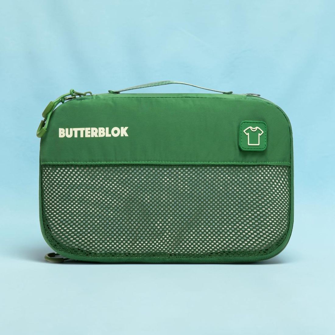 A green Butterblok Medium cube with a T-shirt patch on the front
