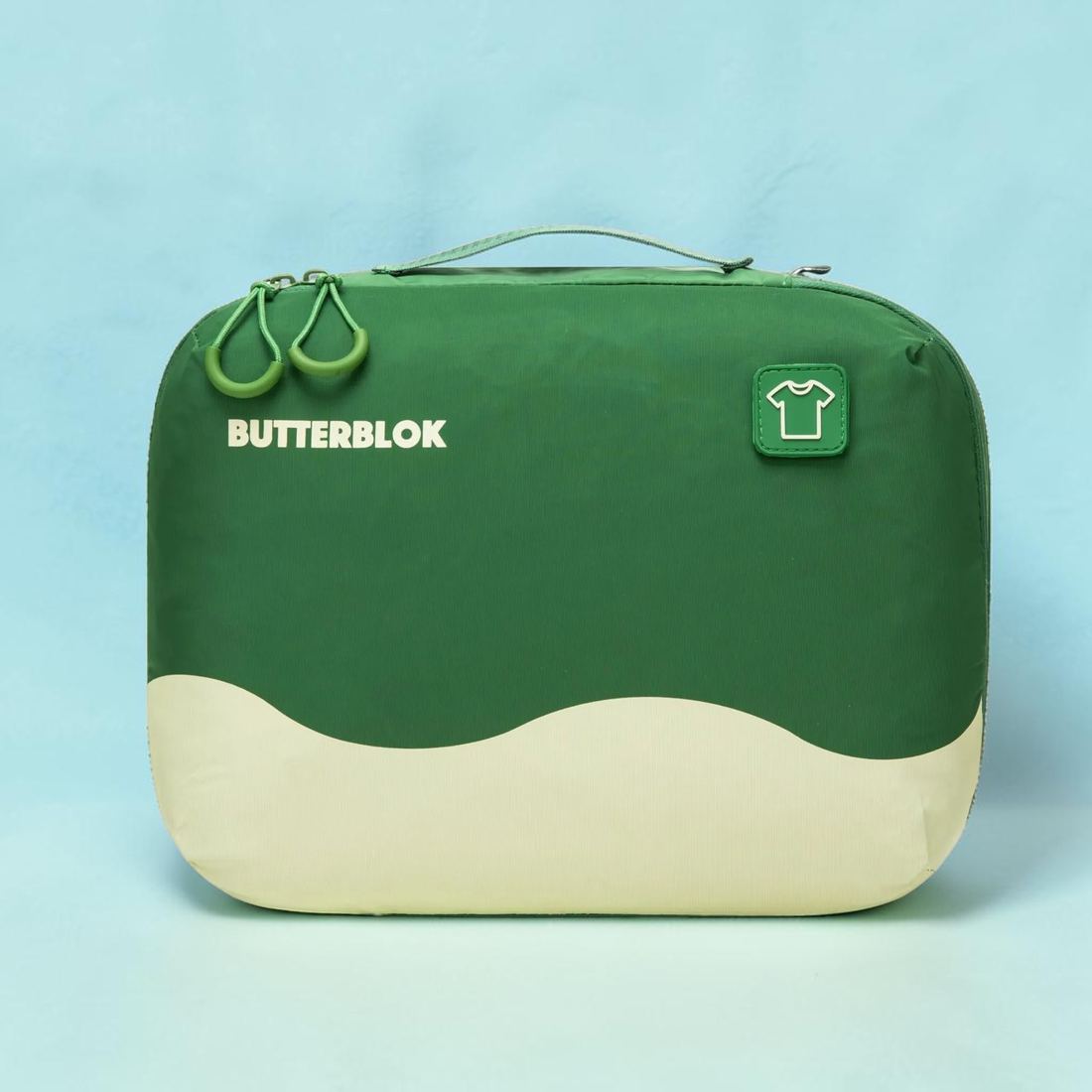 A green and cream Butterblok Wet Blok with droplet zip pulls